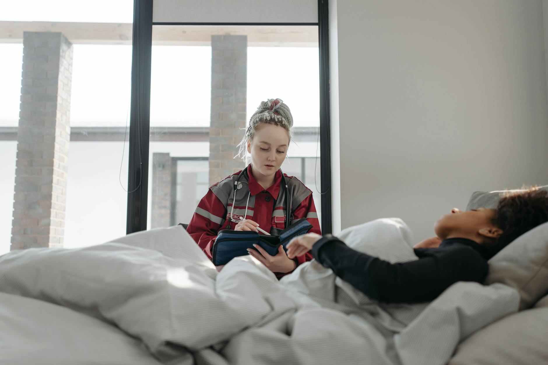 Support worker having a wellbeing conversation with a resident