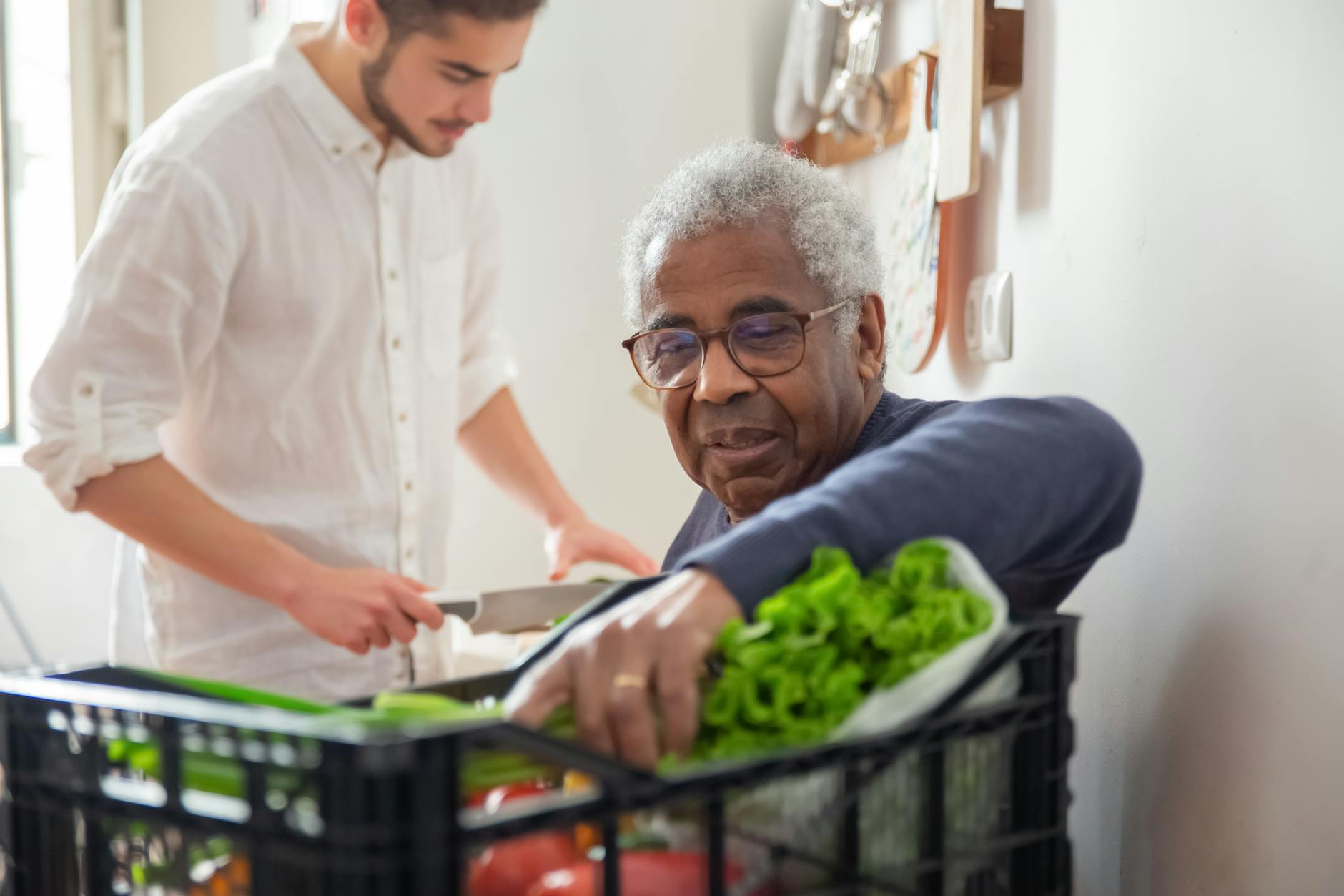 Care worker providing attentive support to a resident